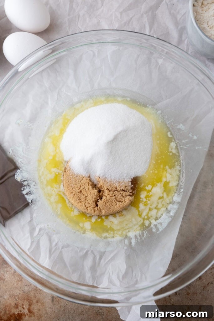 Ultimate Fudgy Brownie Pie 5 unmixed ingredients in a bowl