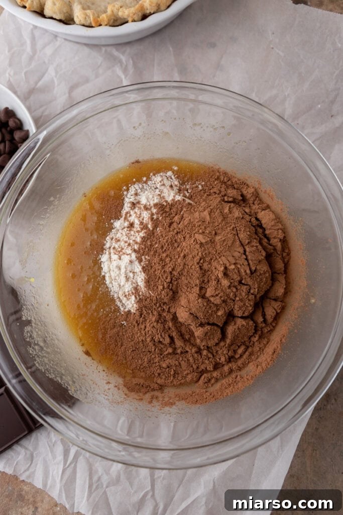 Ultimate Fudgy Brownie Pie 7 mixed ingredients in a bowl