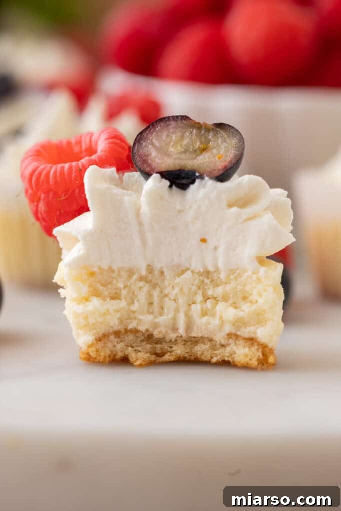 Nilla Wafer Mini Cheesecake Perfection 11 A mini cheesecake with Nilla wafer crust, split open to reveal its creamy interior and the distinct wafer base.