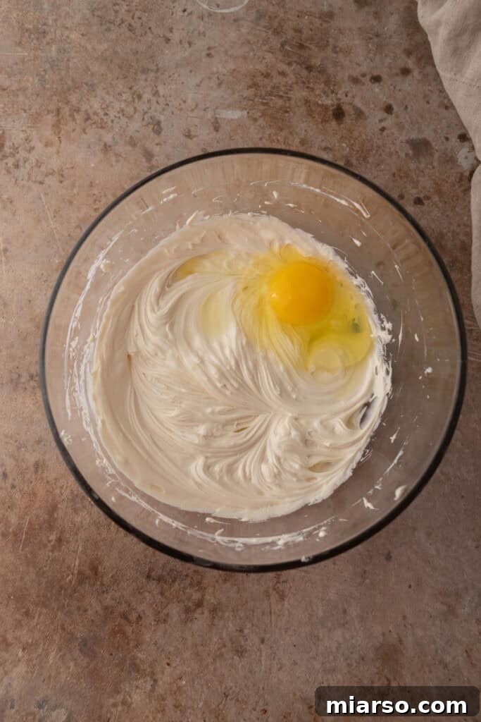 Nilla Wafer Mini Cheesecake Perfection 6 Smooth, mixed cheesecake batter in a bowl after all ingredients are combined.
