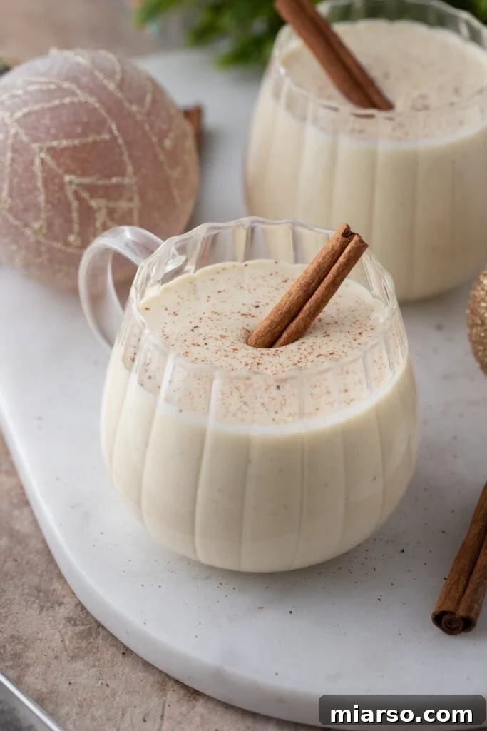 Craft Your Own Creamy Holiday Eggnog 13 homemade eggnog recipe in a glass zoomed out shot