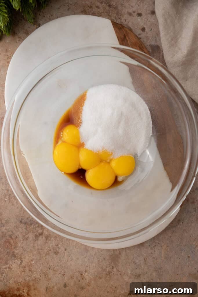 Craft Your Own Creamy Holiday Eggnog 5 unmixed ingredients in a bowl