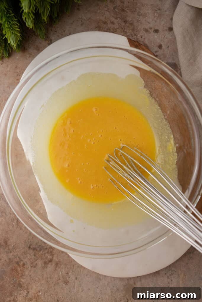 Craft Your Own Creamy Holiday Eggnog 6 mixed ingredients in a bowl