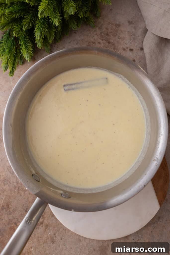 Craft Your Own Creamy Holiday Eggnog 10 mixed ingredients in a pot