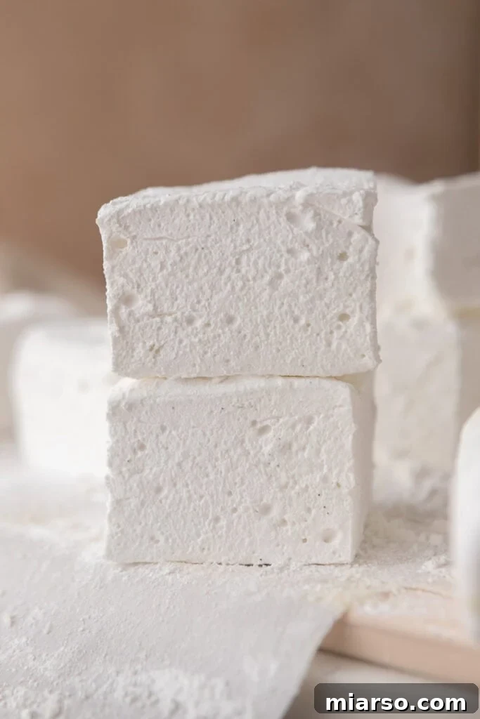homemade marshmallows stacked high, showcasing their volume