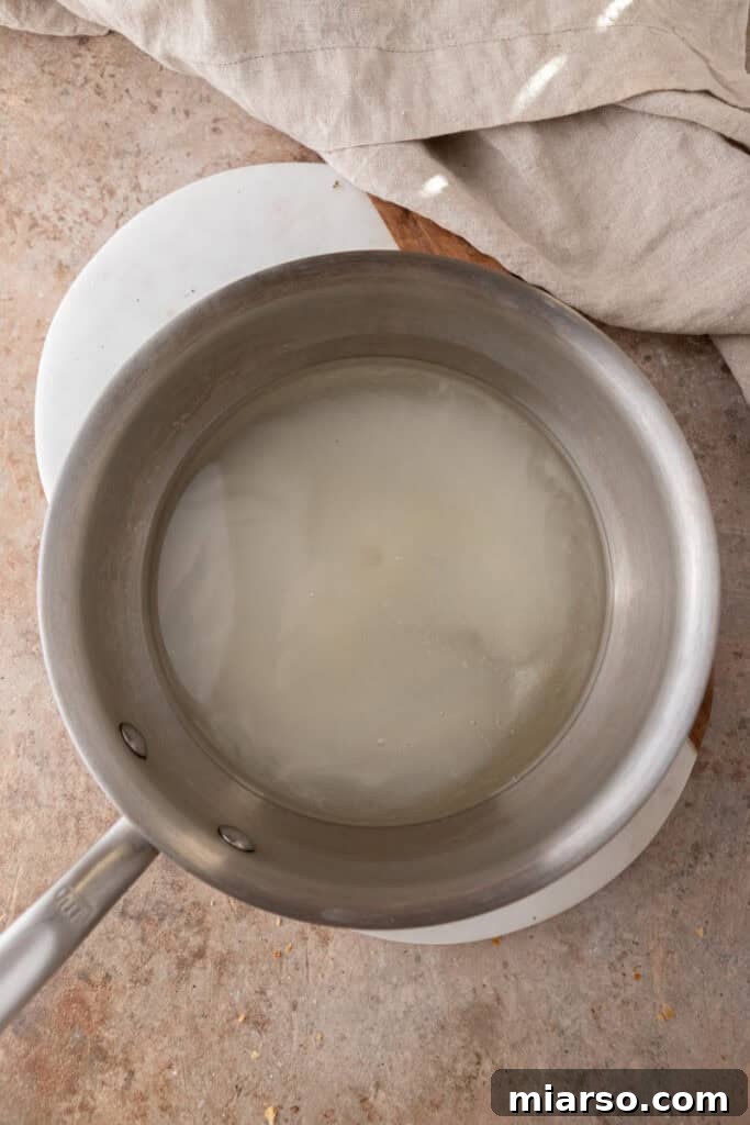 sugar and water in a pot, starting to heat up