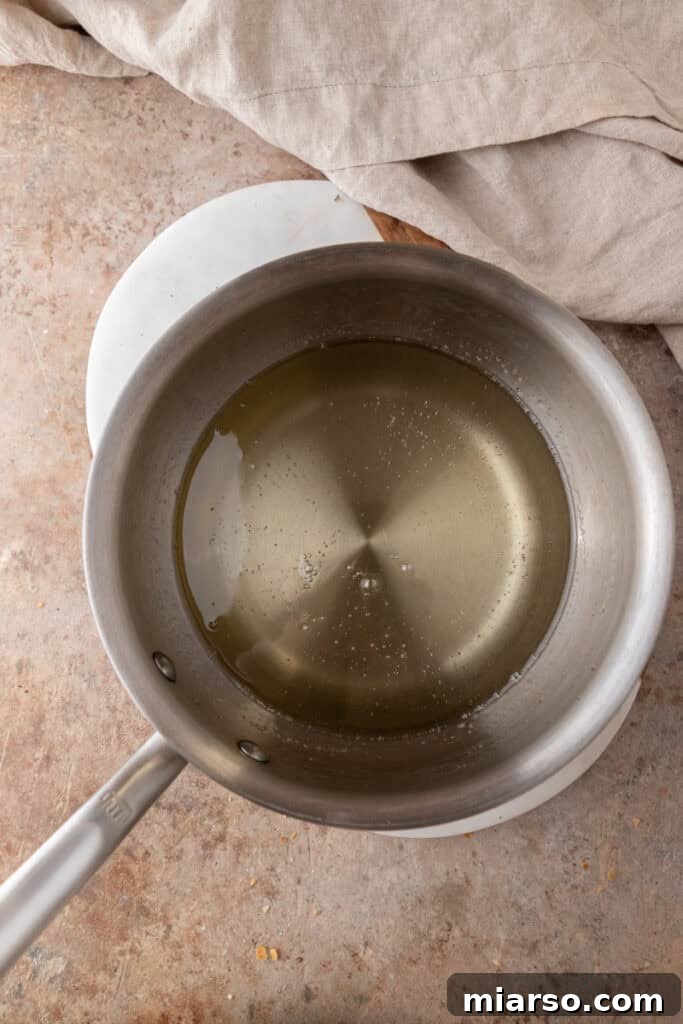 mixed ingredients in a pot, simmering to syrup stage