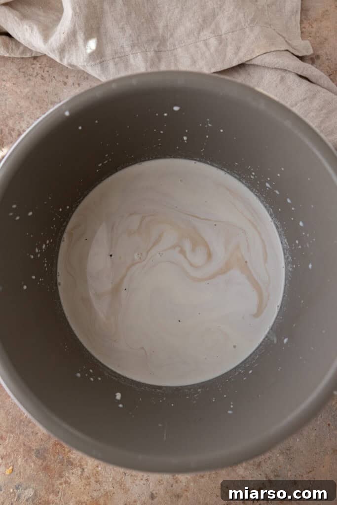 Milk and cream mixture in a slow cooker.