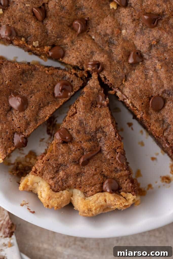 overhead shot of the chocolate chip cookie pie recipe, showcasing its golden crust and melted chocolate chips