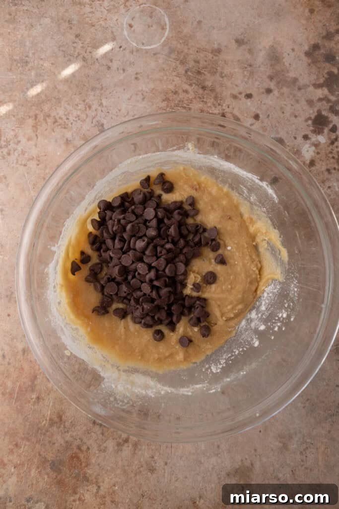 unmixed ingredients for cookie pie in a bowl, showing dry and wet components separate