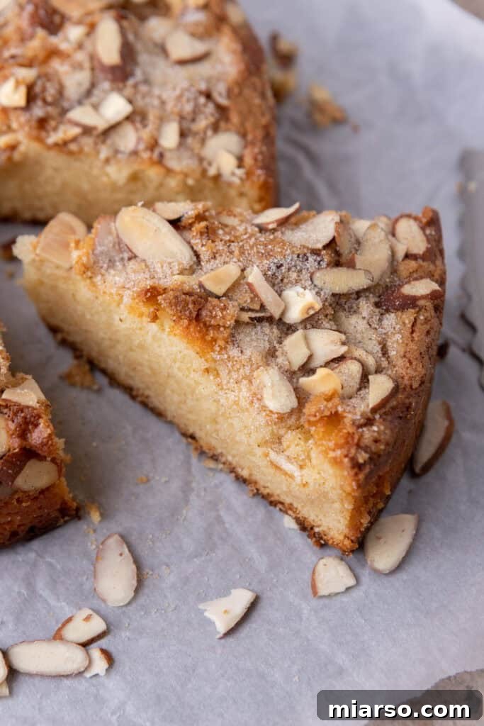 A perfectly baked slice of homemade almond cake, ready to be enjoyed
