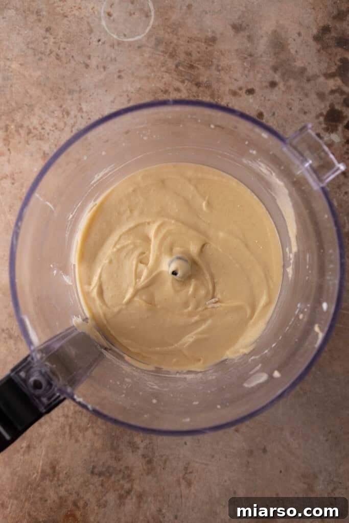 Smooth and creamy almond cake batter in the food processor