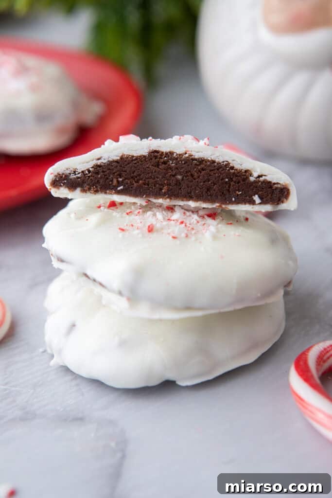 Irresistible Peppermint Bark Cookies 4 Stack of freshly baked chocolate peppermint bark cookies, ready to be enjoyed.