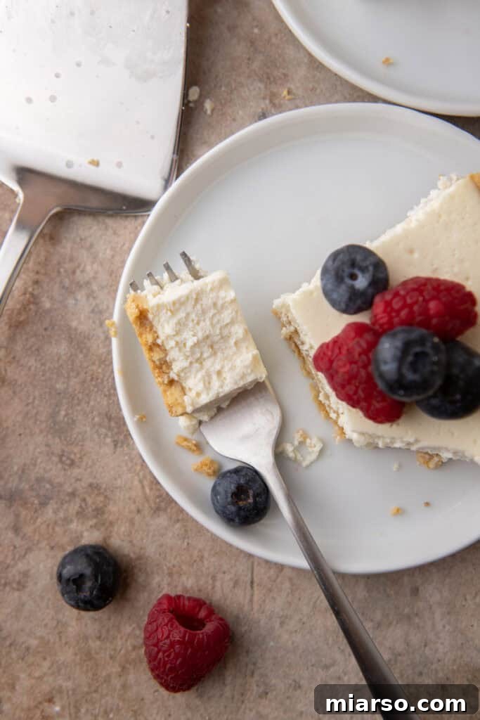 High Protein Cottage Cheese Cheesecake being scooped up on a fork