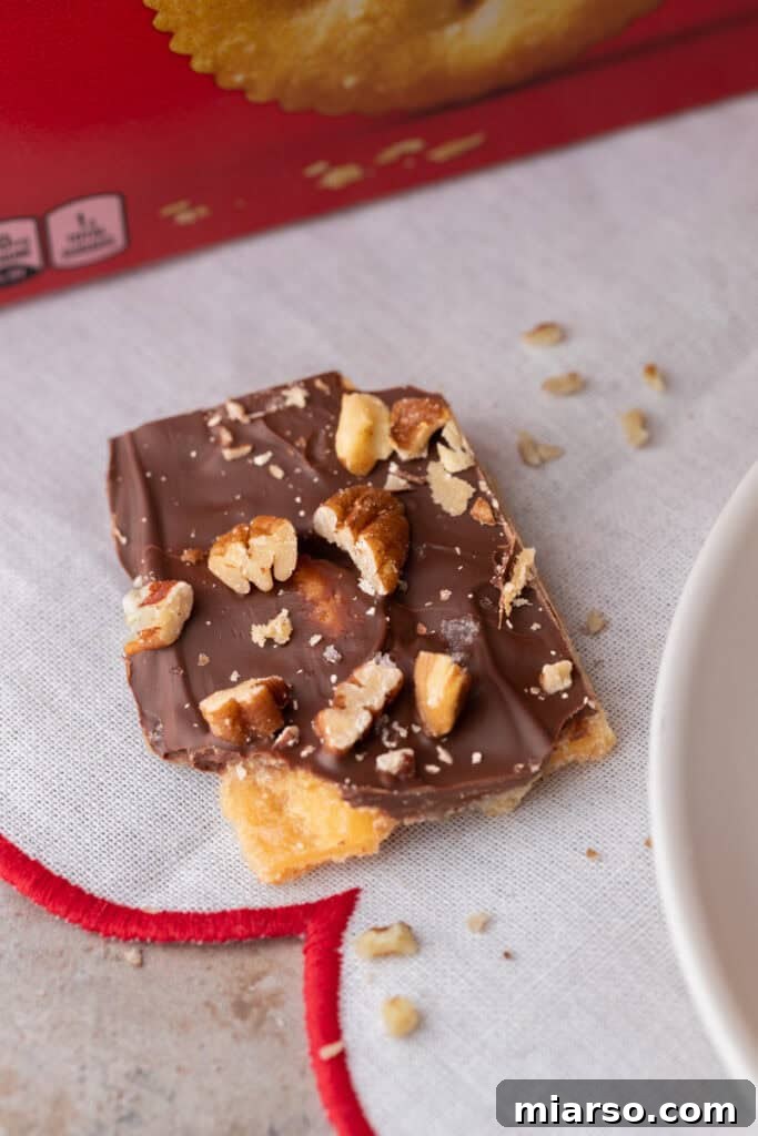 Sweet & Salty Holiday Ritz Toffee Bark 11 a single piece of the Ritz Cracker Toffee Christmas Crack recipe