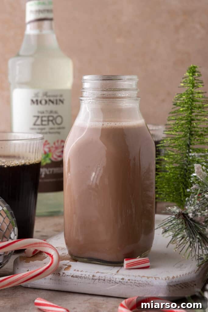 The Ultimate DIY Peppermint Mocha Creamer 2 Homemade Peppermint Mocha Creamer in a glass bottle with coffee cup