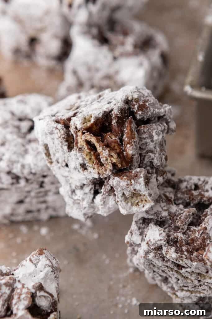 Irresistible Muddy Buddy Bars 13 muddy buddy bars recipe stacked on top of each other