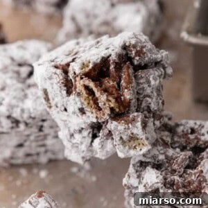 Irresistible Muddy Buddy Bars 16 muddy buddy bars recipe stacked on top of each other
