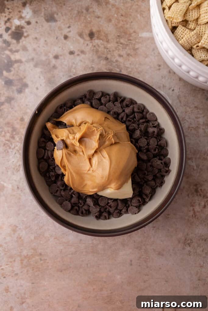 Irresistible Muddy Buddy Bars 5 unmixed ingredients in a bowl