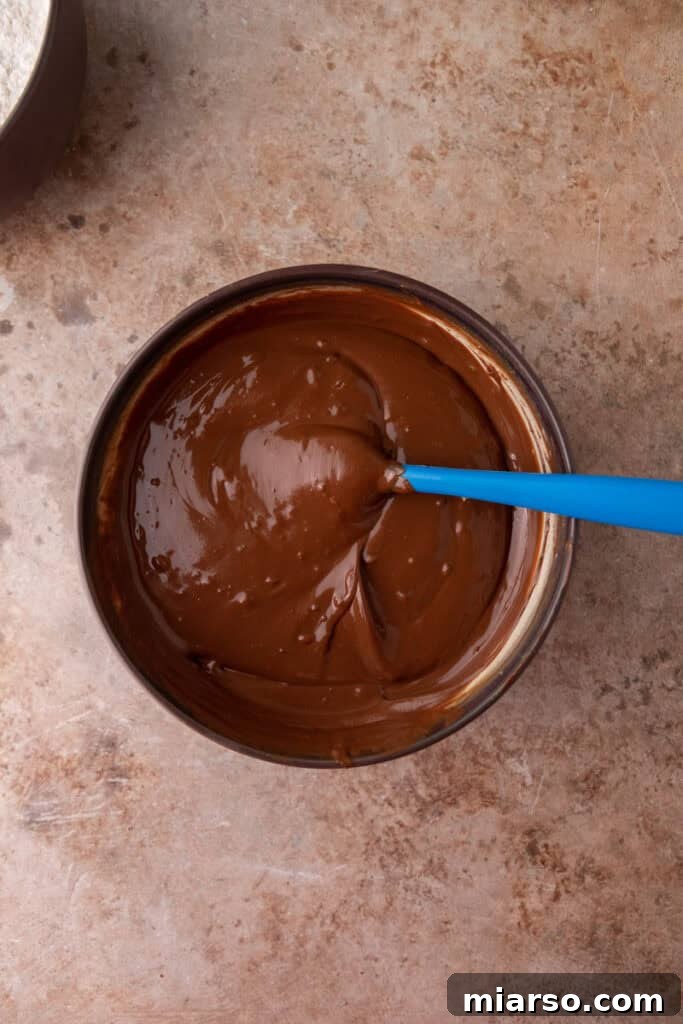 Irresistible Muddy Buddy Bars 7 mixed ingredients in a bowl