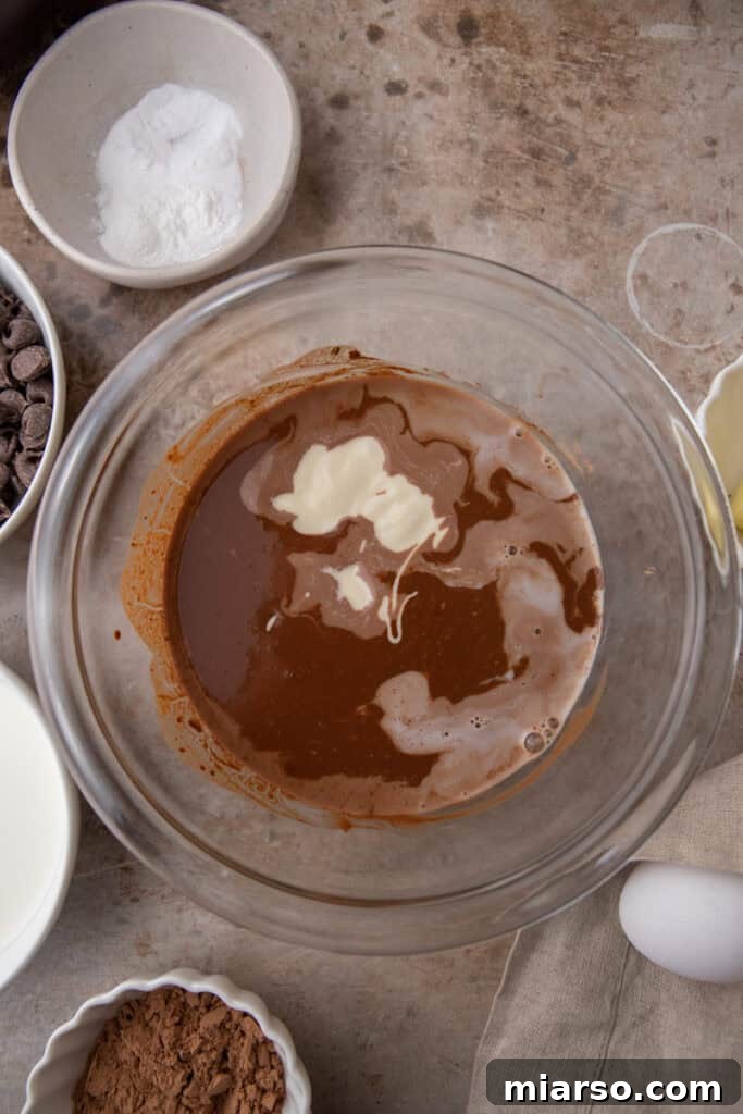 Bowl of dry ingredients (flour, sugar) waiting to be mixed for the cake batter.