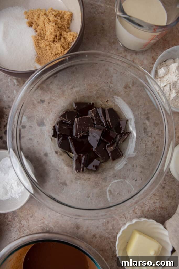 Bowl containing melted chocolate and vegetable oil, ready for the next steps.