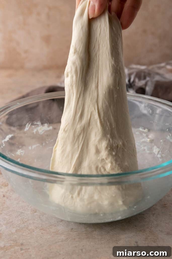dough getting stretched and folded