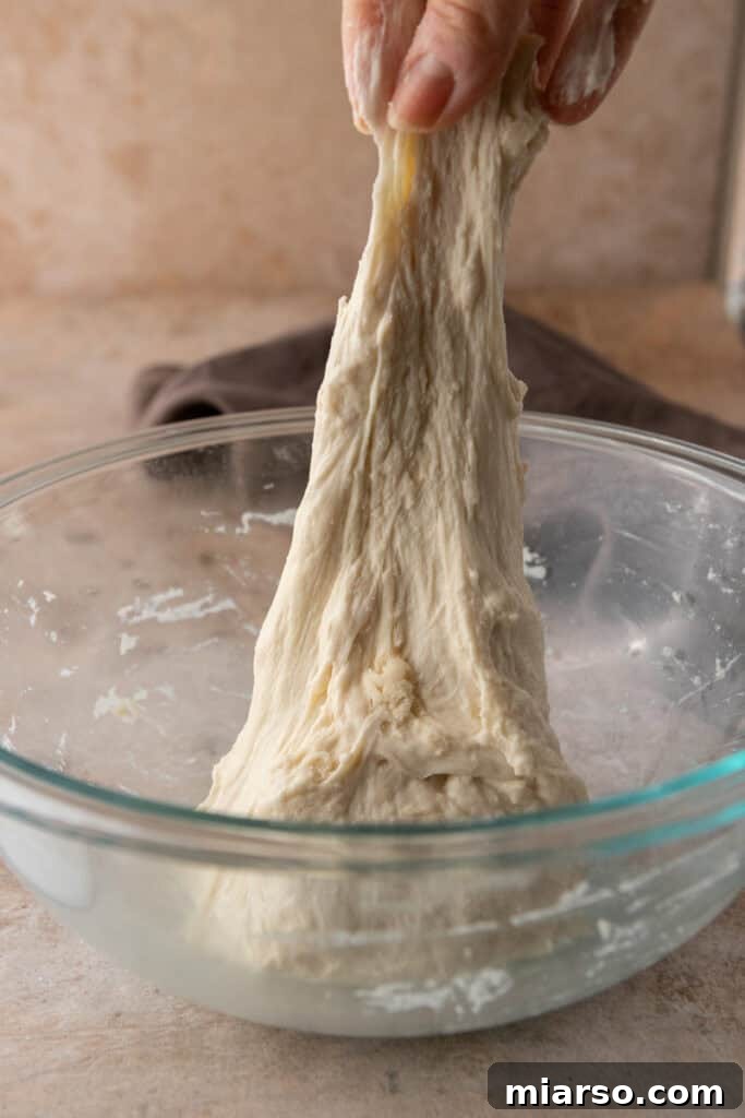 dough getting stretched and folded