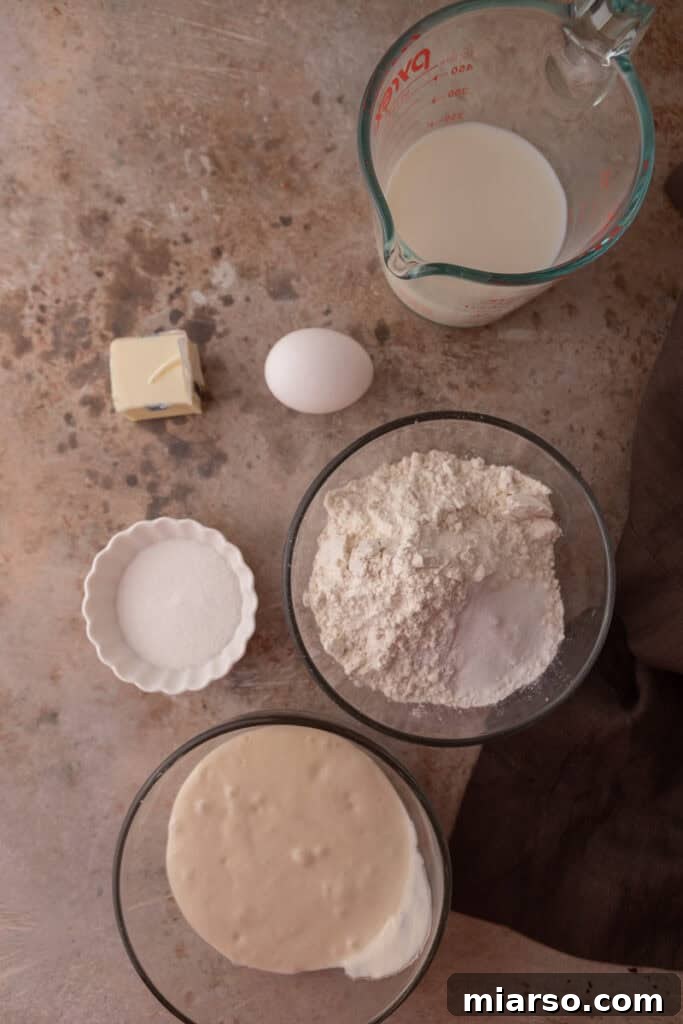 Ingredients for sourdough discard pancakes laid out on a kitchen counter