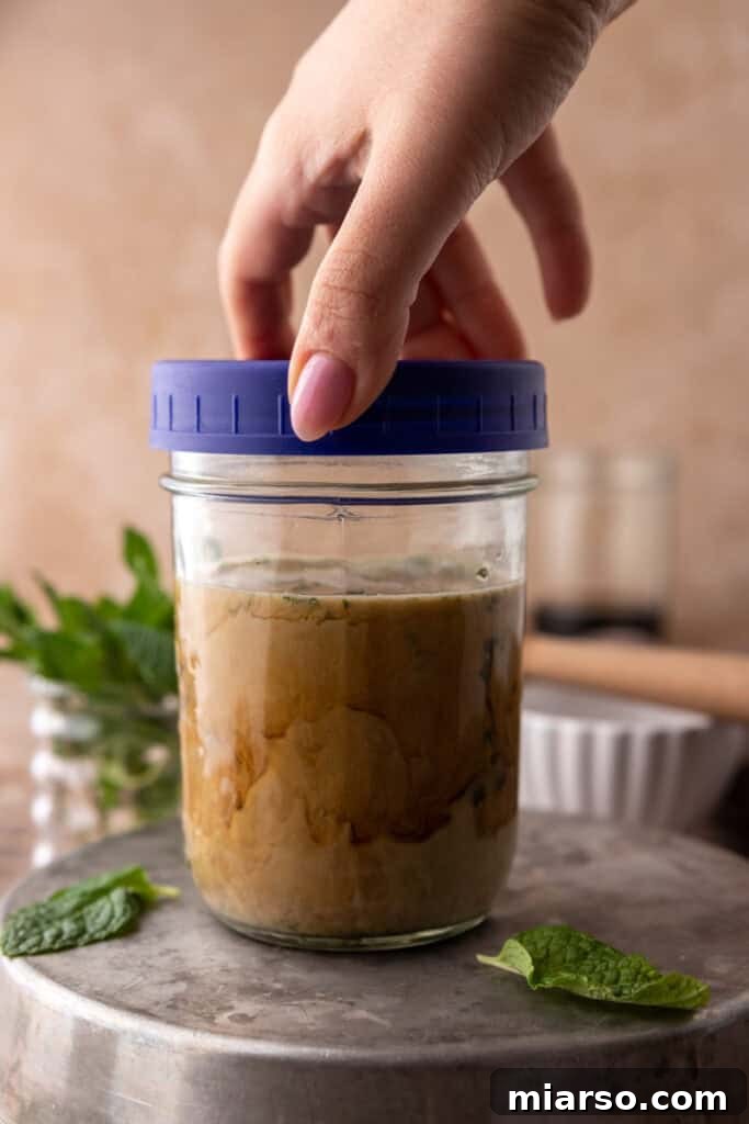DIY Phylz Mint Mojito Iced Coffee 10 Hand closing lid of mason jar