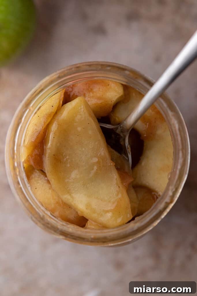 Effortless Apple Filling for Delicious Desserts 13 An overhead shot of homemade apple filling in a glass jar, perfect for storage or gifting.