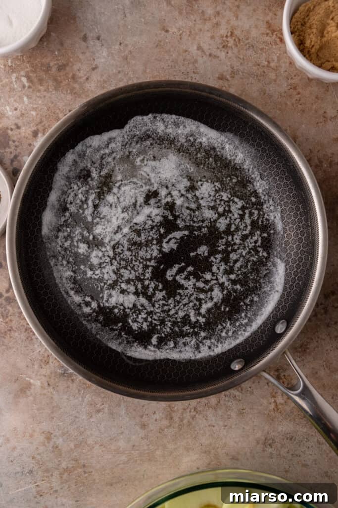 Effortless Apple Filling for Delicious Desserts 6 Butter melting gently in a saucepan over medium heat.