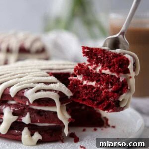 Indulgent Red Velvet Pancakes 13 A stack of Red Velvet Pancakes Recipe on a plate, ready to be served.