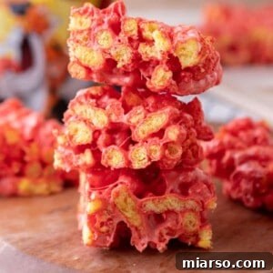 Hot Cheetos Marshmallow Crispy Treats recipe stacked on each other