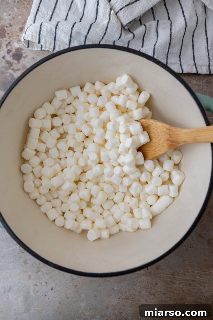 Butter melting in a pot on the stove.