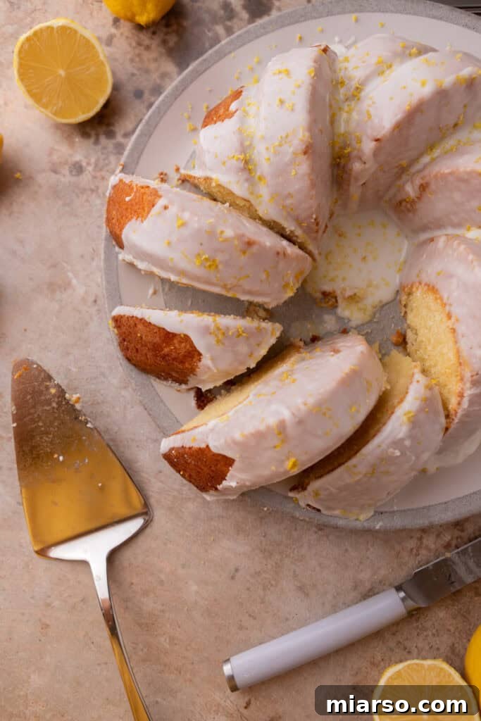 Overhead view of several slices of lemon bundt cake on a serving board.