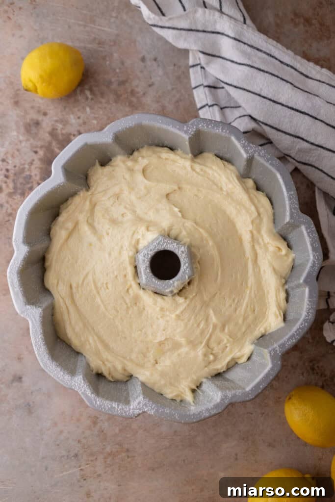 Cake batter poured into a bundt pan