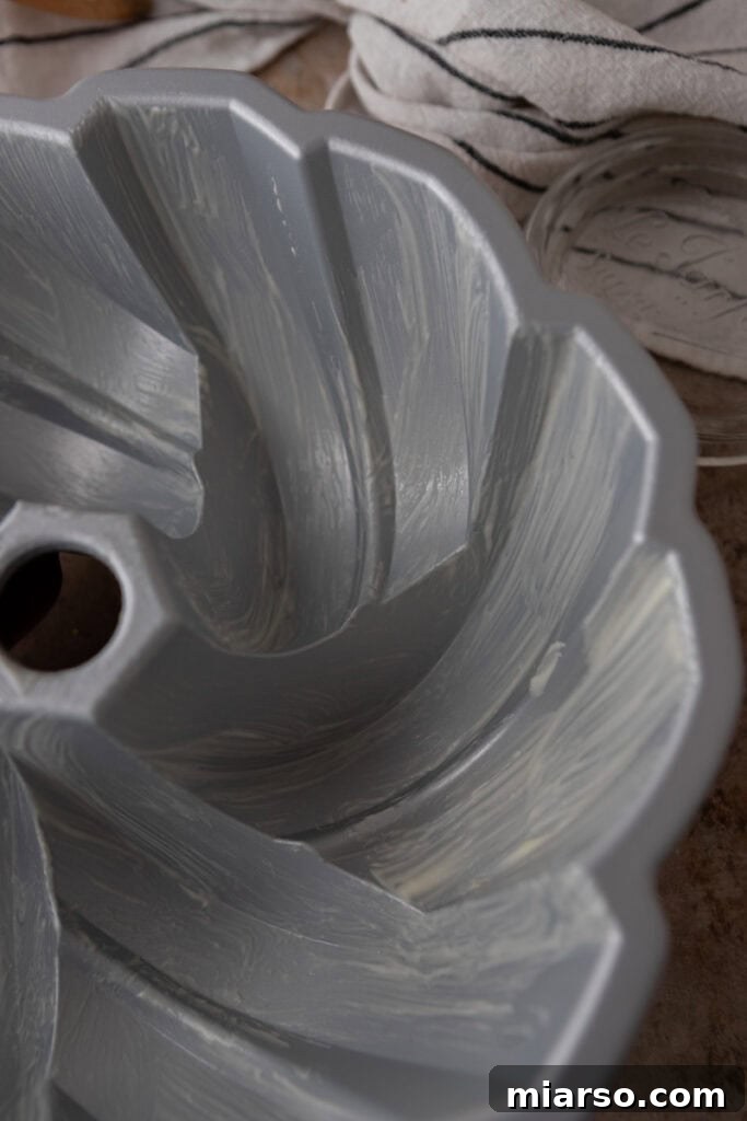 A Bundt pan perfectly coated with homemade cake release, ready for batter.