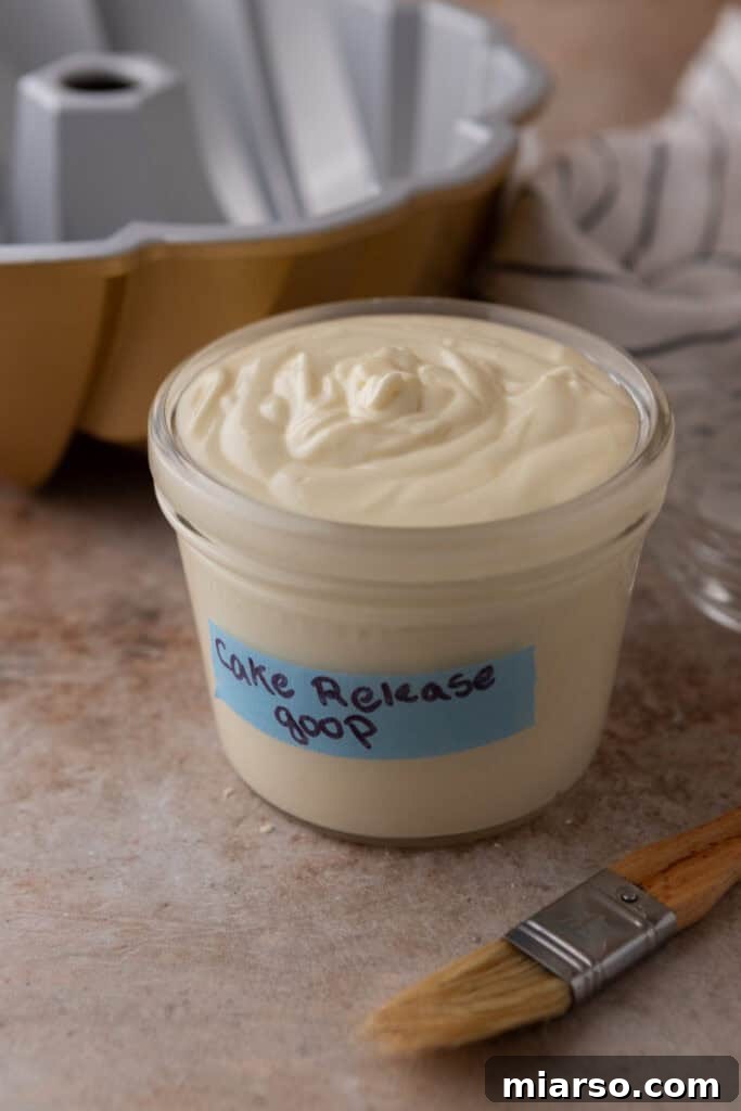 Homemade Cake Release in a mason jar with a pastry brush, ready to be used.