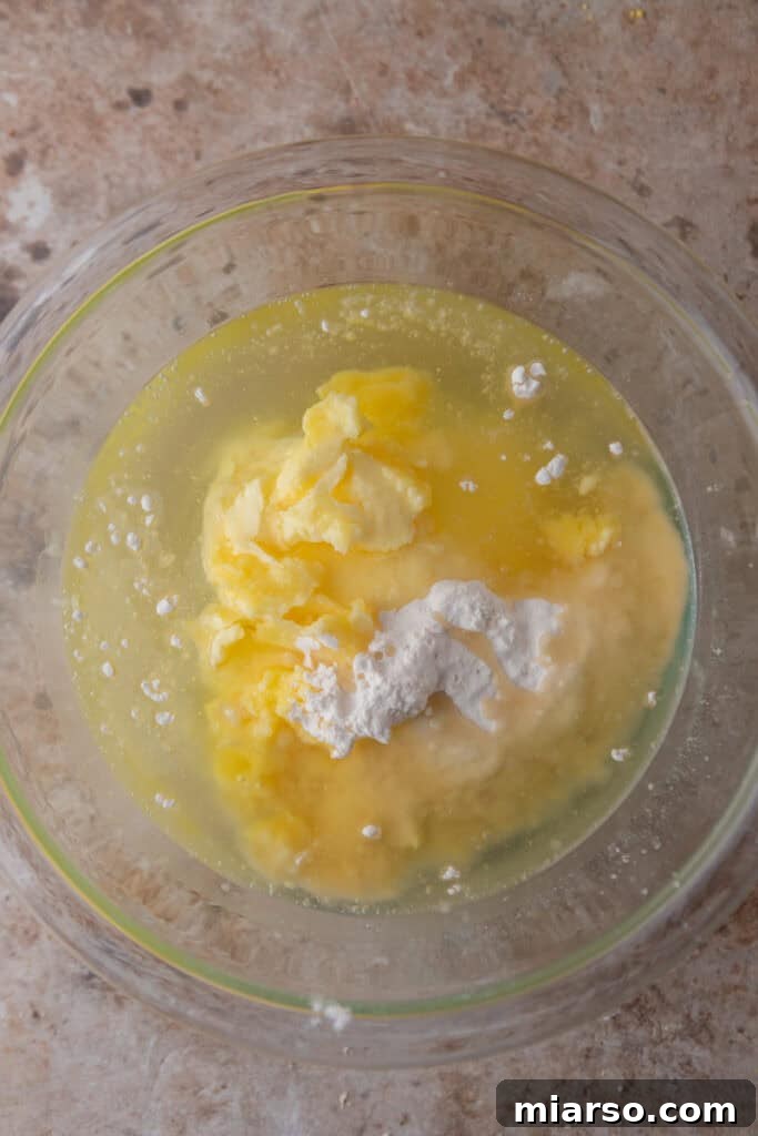 Unmixed ingredients for cake release in a bowl before combining.