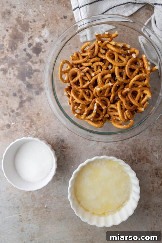 Ultimate Pretzel Pie Crust 3 Pretzel pie crust recipe ingredients laid out: butter, granulated sugar, and pretzels.
