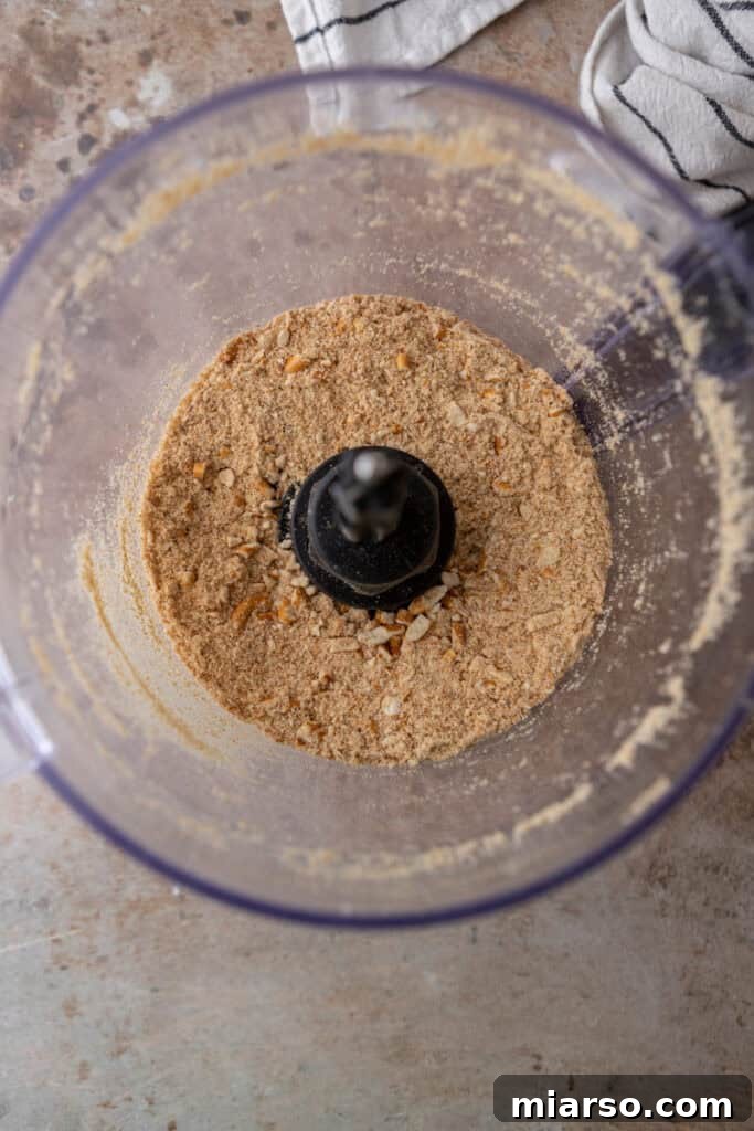 Ultimate Pretzel Pie Crust 5 Pretzels being crushed in a food processor for the pie crust.