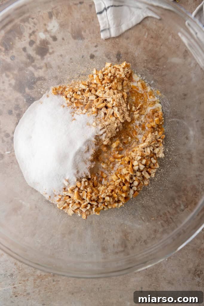 Ultimate Pretzel Pie Crust 6 Unmixed dry ingredients (pretzel crumbs and sugar) in a bowl.