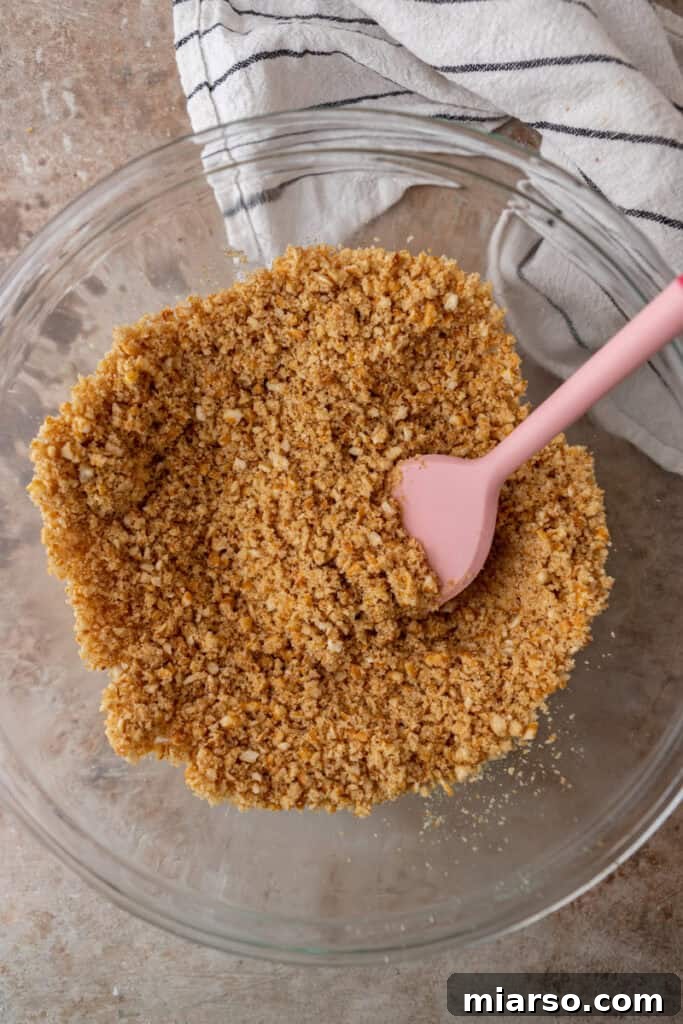 Ultimate Pretzel Pie Crust 7 Mixed pretzel crumbs, sugar, and melted butter in a bowl, ready to be pressed.