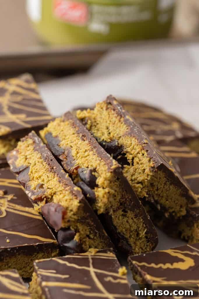 Multiple pieces of Dubai Chocolate Date Bark, highlighting the textures of date, kataifi, and chocolate.