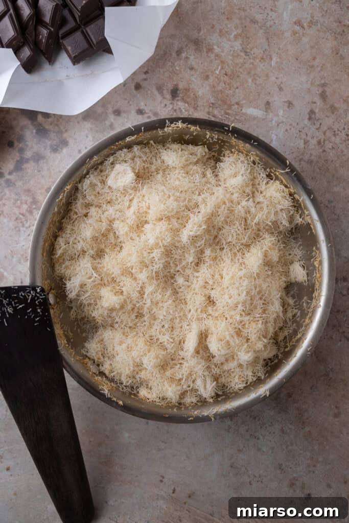 Kataifi dough being toasted in a pan with butter, turning golden brown.