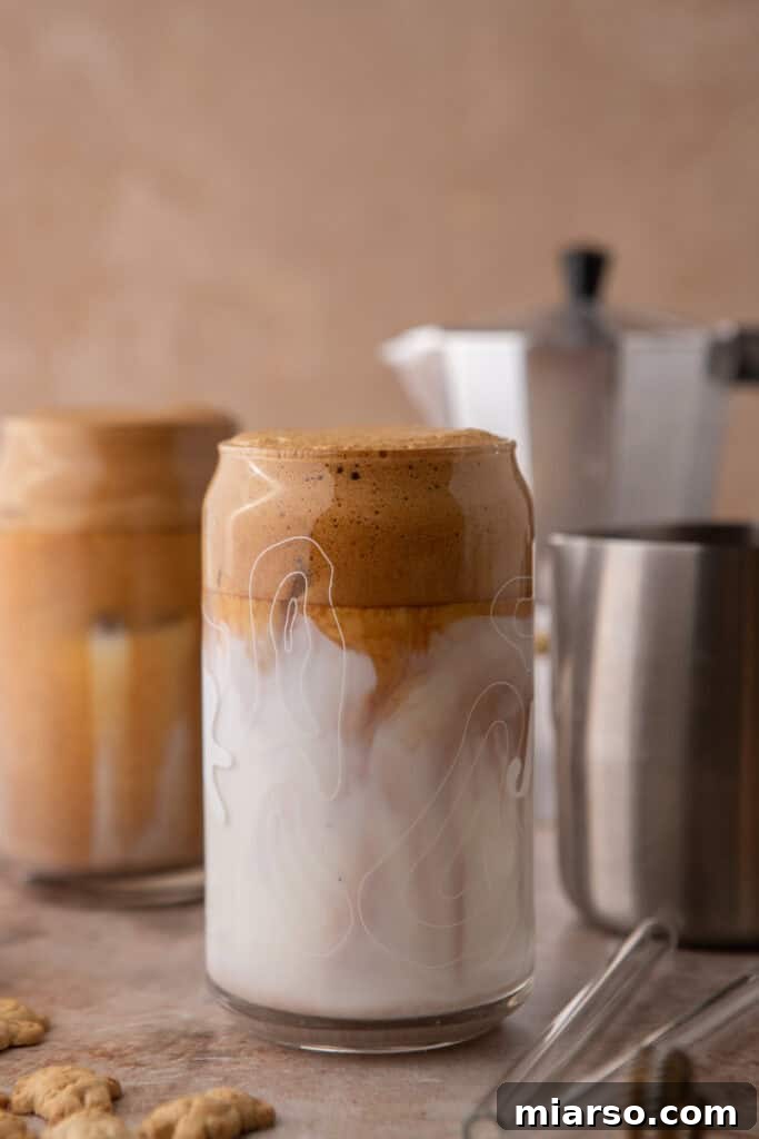 coffee mixture being poured over milk