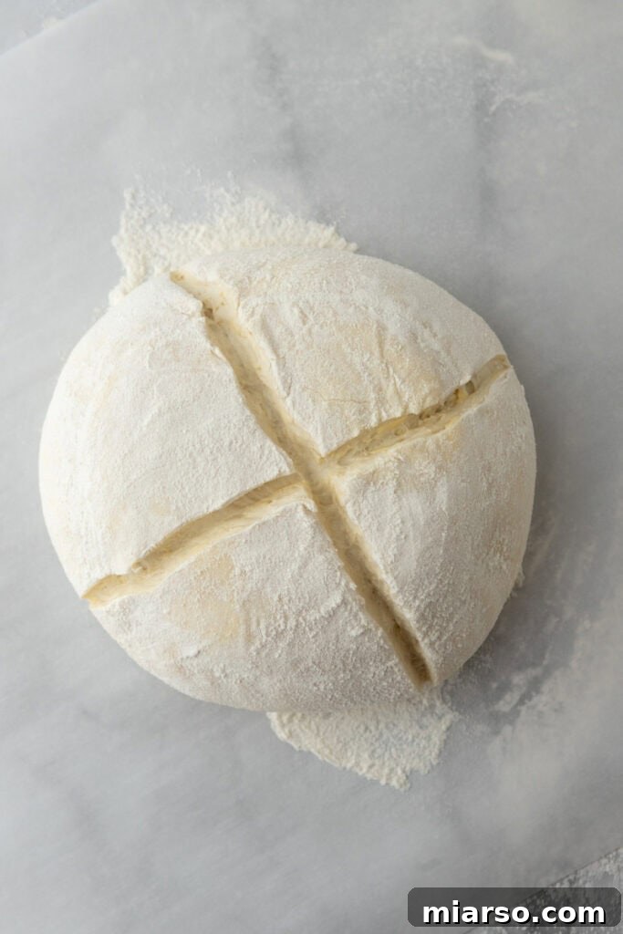 Elevate Your Baking Perfect Sourdough Croissant Bread 19 dough ball being scored