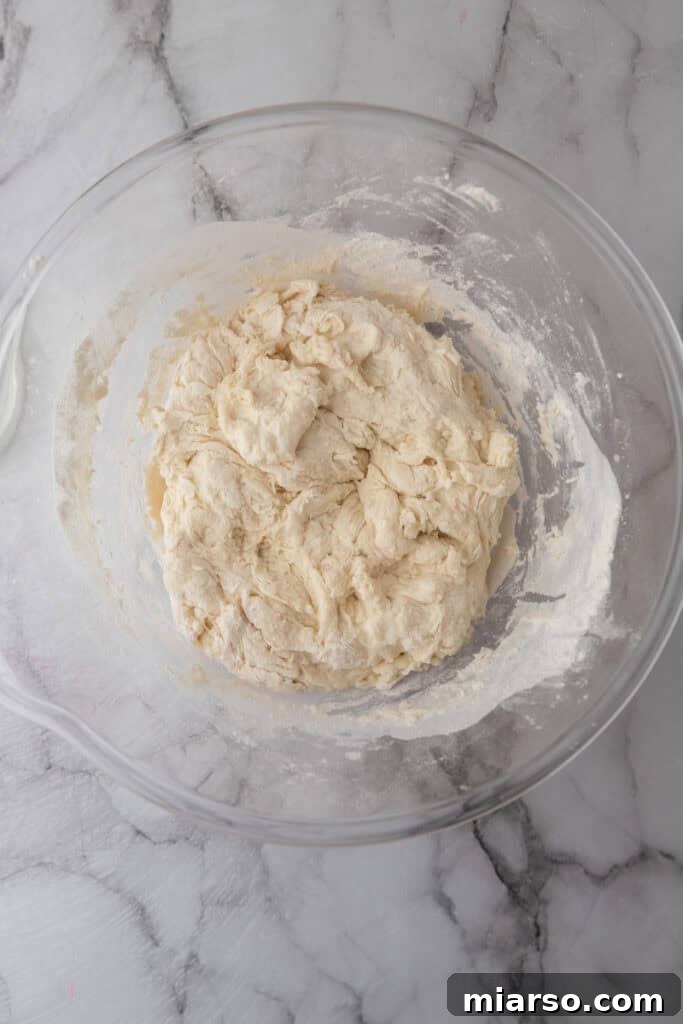 Elevate Your Baking Perfect Sourdough Croissant Bread 8 mixed ingredients in a bowl