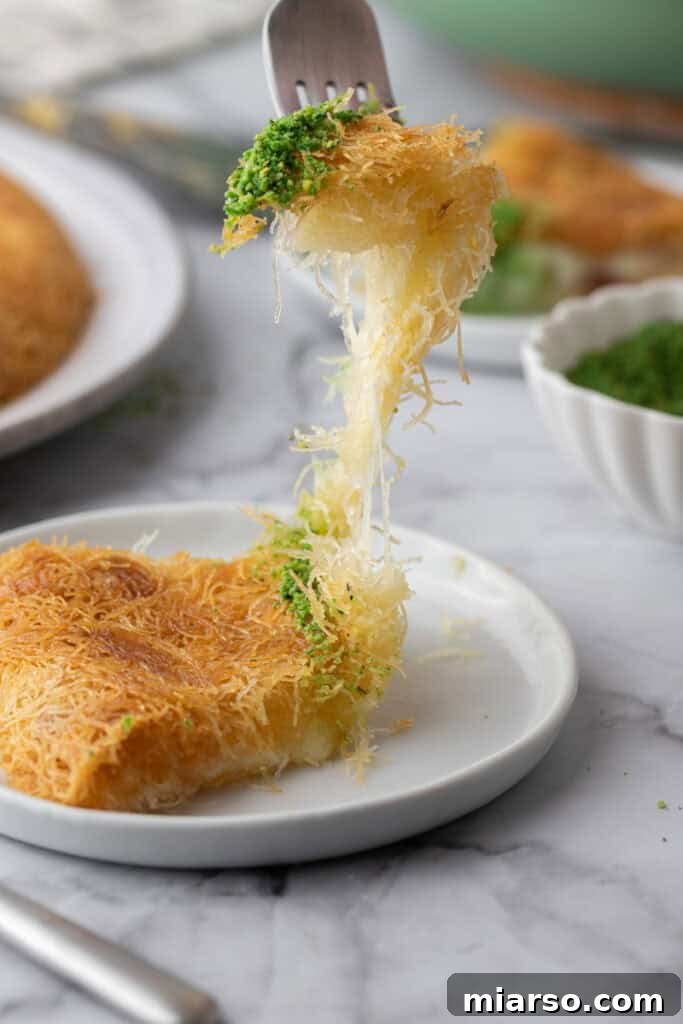 slice of the easy kunafa recipe with simple ingredients being pulled up